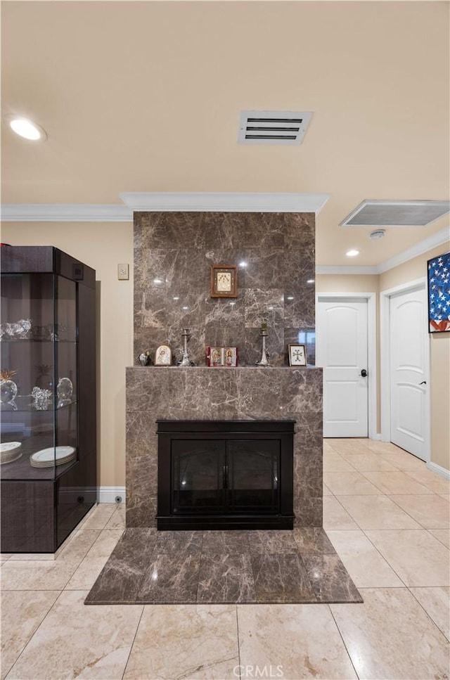 detailed view of crown molding, baseboards, a high end fireplace, and recessed lighting