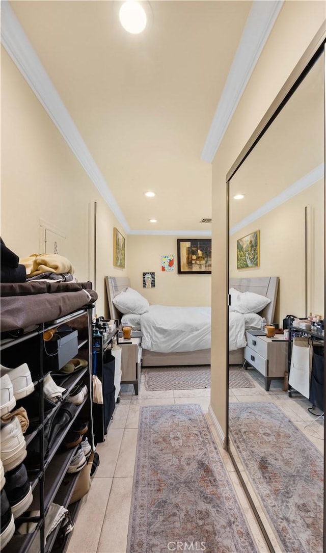 bedroom with ornamental molding, light tile patterned floors, and recessed lighting