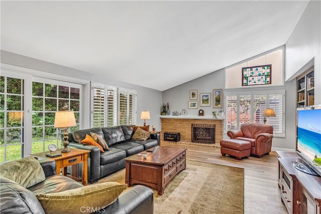 25572 Saltwater Dr, Dana Point, CA 92629 - living room with lofted ceiling, wood finished floors, and a fireplace