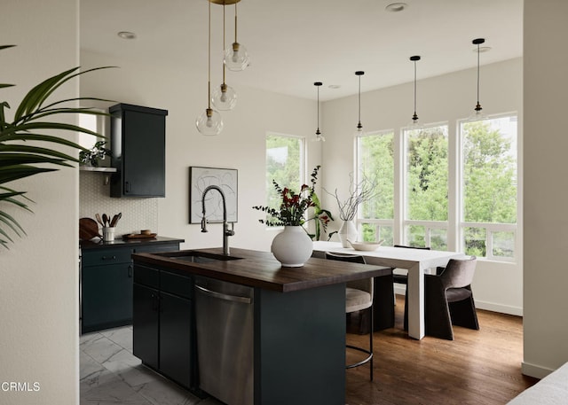 3826 Clayton Ave, Los Angeles, CA 90027 - kitchen featuring dishwasher, a sink, wooden counters, and dark cabinetry