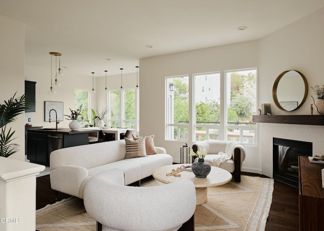 3826 Clayton Ave, Los Angeles, CA 90027 - living area featuring wood finished floors, a glass covered fireplace, and recessed lighting