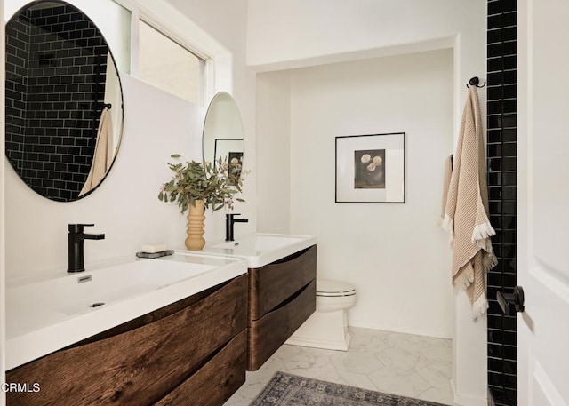 3826 Clayton Ave, Los Angeles, CA 90027 - full bath with marble finish floors, double vanity, baseboards, and toilet