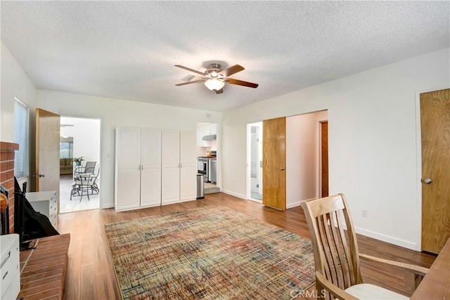 39671 Cherry Valley Blvd, Cherry Valley, CA 92223 - office space featuring a ceiling fan, light wood finished floors, a textured ceiling, and baseboards