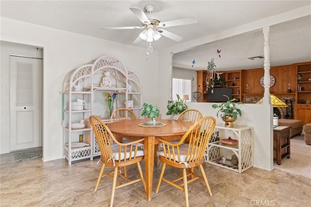 54955 Benecia Trl, Yucca Valley, CA 92284 - dining room featuring ceiling fan and a textured ceiling