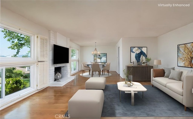 living room with wood finished floors and a chandelier
