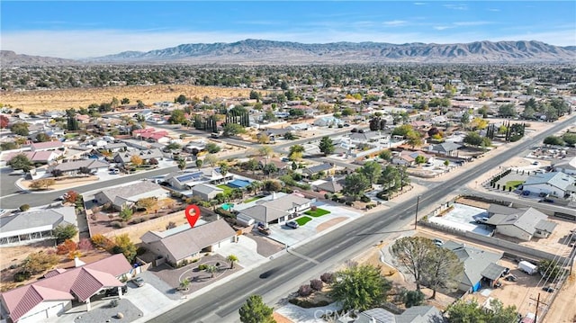 13935 Rincon Rd, Apple Valley, CA 92307 - aerial perspective of suburban area featuring a mountainous background