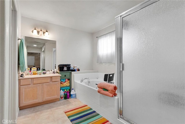 13935 Rincon Rd, Apple Valley, CA 92307 - bathroom with a stall shower, tile patterned flooring, a garden tub, and vanity