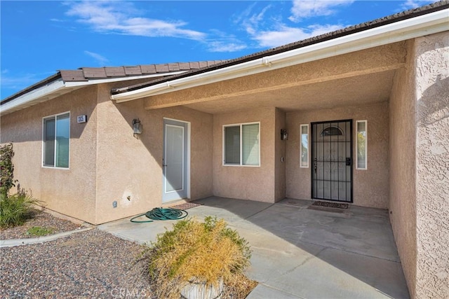13935 Rincon Rd, Apple Valley, CA 92307 - property entrance featuring stucco siding