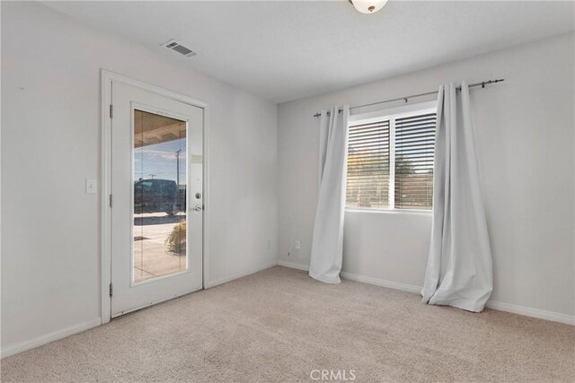 13935 Rincon Rd, Apple Valley, CA 92307 - empty room featuring carpet floors, healthy amount of natural light, and baseboards