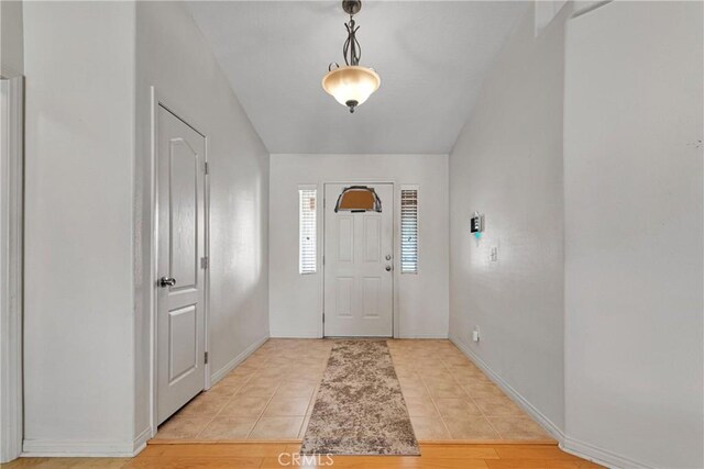 13935 Rincon Rd, Apple Valley, CA 92307 - foyer entrance with baseboards and light tile patterned flooring