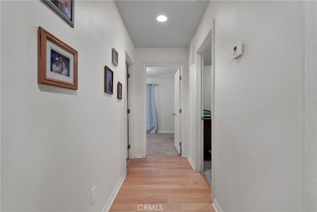 13935 Rincon Rd, Apple Valley, CA 92307 - hall with light wood-style floors, baseboards, and recessed lighting