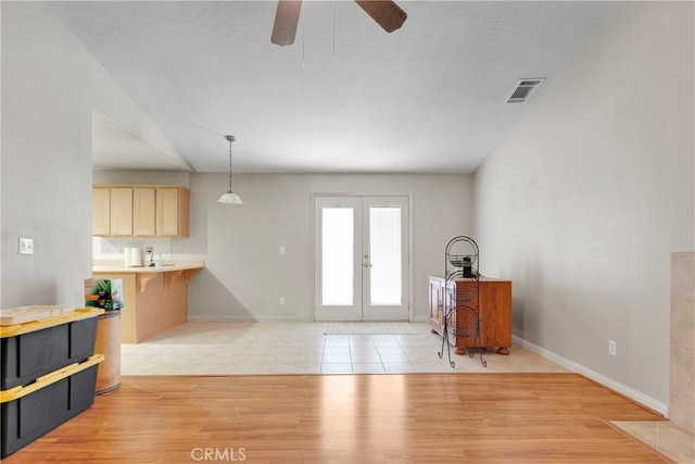 13935 Rincon Rd, Apple Valley, CA 92307 - foyer with a ceiling fan, french doors, baseboards, and light wood-style floors