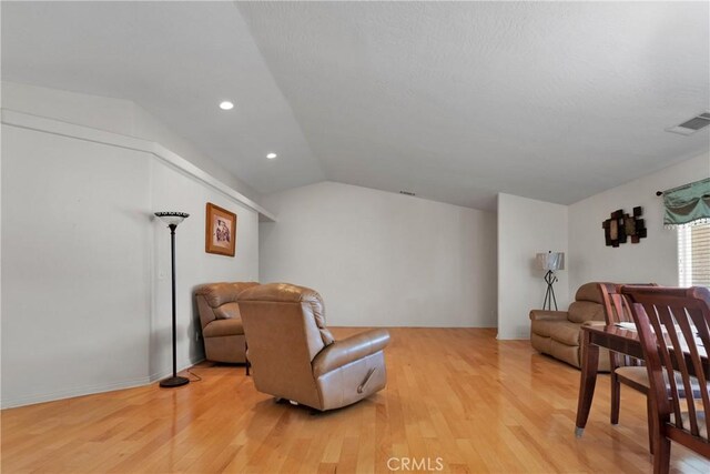 13935 Rincon Rd, Apple Valley, CA 92307 - sitting room featuring light wood-type flooring, lofted ceiling, and recessed lighting