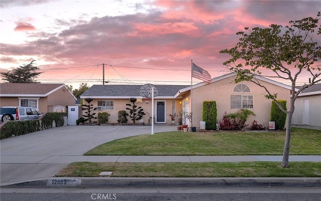 12653 Vandemere St, Lakewood, CA 90715 - ranch-style home with driveway, a lawn, and stucco siding