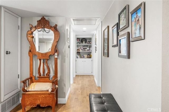 12653 Vandemere St, Lakewood, CA 90715 - hallway featuring light wood-style floors, baseboards, and attic access