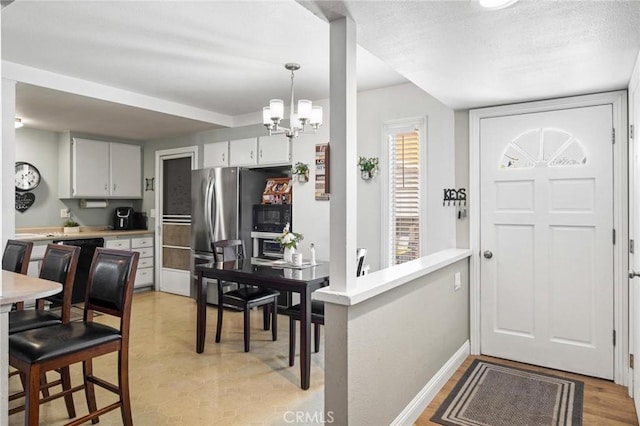 12653 Vandemere St, Lakewood, CA 90715 - entrance foyer with a chandelier and baseboards