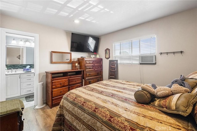 12653 Vandemere St, Lakewood, CA 90715 - bedroom with light wood-style flooring, a sink, cooling unit, ensuite bath, and recessed lighting
