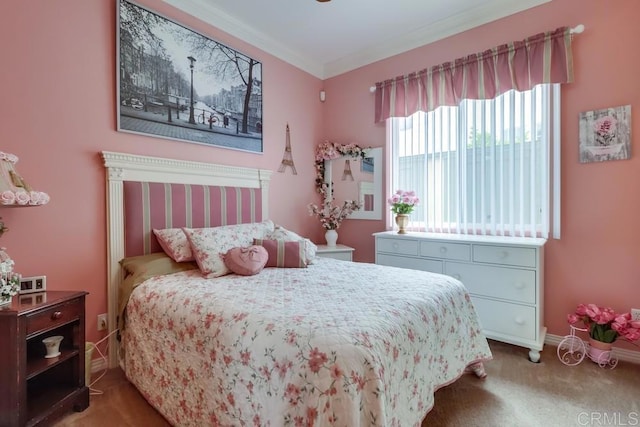 carpeted bedroom with ornamental molding and baseboards