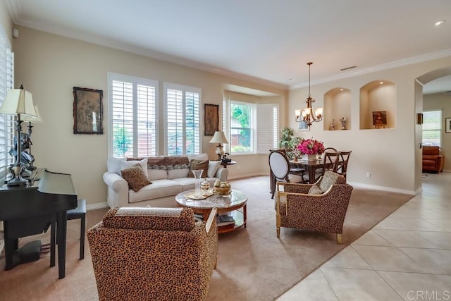 living area featuring crown molding, light tile patterned flooring, a chandelier, and baseboards