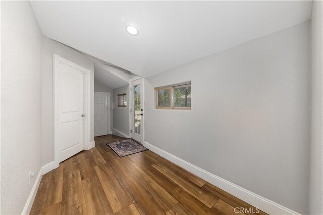 35602 Carter St, Yucaipa, CA 92399 - doorway to outside featuring baseboards, vaulted ceiling, wood finished floors, and recessed lighting