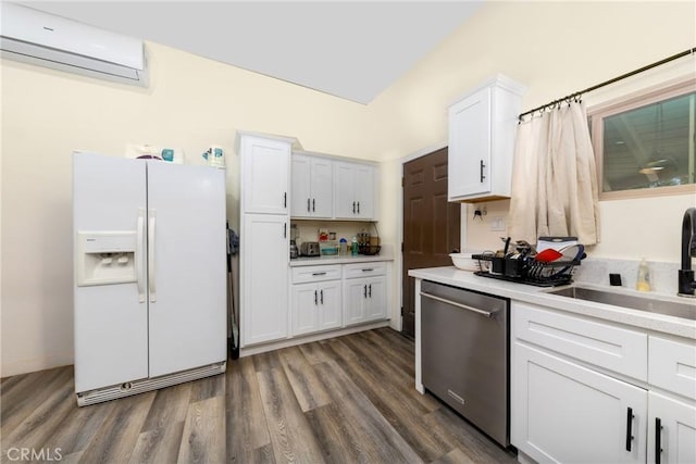 35602 Carter St, Yucaipa, CA 92399 - kitchen featuring white refrigerator with ice dispenser, stainless steel dishwasher, an AC wall unit, white cabinetry, and wood finished floors