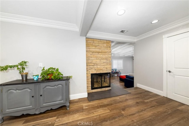 35602 Carter St, Yucaipa, CA 92399 - living room with wood finished floors, baseboards, ornamental molding, beamed ceiling, and a multi sided fireplace