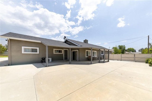 35602 Carter St, Yucaipa, CA 92399 - back of property featuring a gate, a patio, fence, and stucco siding