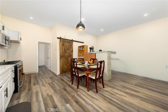 35602 Carter St, Yucaipa, CA 92399 - dining area with a barn door, dark wood-style flooring, and recessed lighting