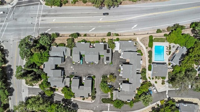 aerial view of property's location featuring a pool area