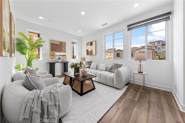 27 Alessio, Lake Forest, CA 92630 - living room with wood finished floors, baseboards, and recessed lighting