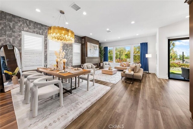 27 Alessio, Lake Forest, CA 92630 - dining space featuring a chandelier, wood finished floors, recessed lighting, and arched walkways