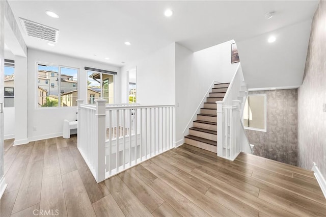 27 Alessio, Lake Forest, CA 92630 - staircase featuring wood finished floors, recessed lighting, and wallpapered walls