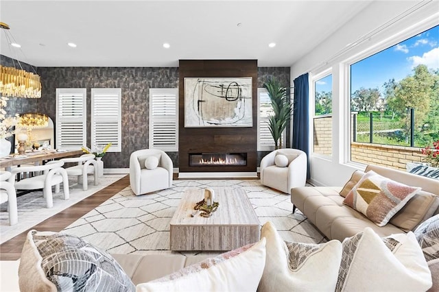 27 Alessio, Lake Forest, CA 92630 - living room featuring a fireplace, a chandelier, wood finished floors, and recessed lighting