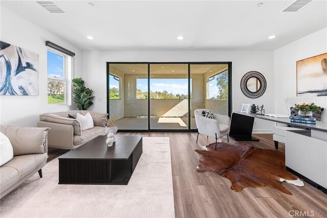 27 Alessio, Lake Forest, CA 92630 - living area featuring plenty of natural light, wood finished floors, and recessed lighting