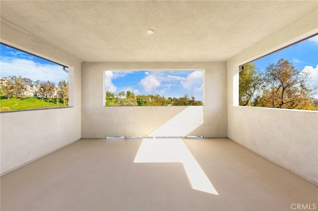 27 Alessio, Lake Forest, CA 92630 - unfurnished room featuring concrete floors and a textured ceiling