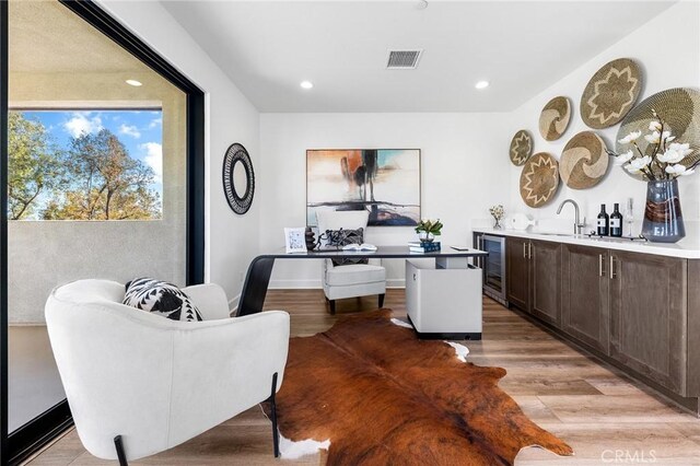 27 Alessio, Lake Forest, CA 92630 - office area featuring wine cooler, light wood-style flooring, wet bar, and recessed lighting