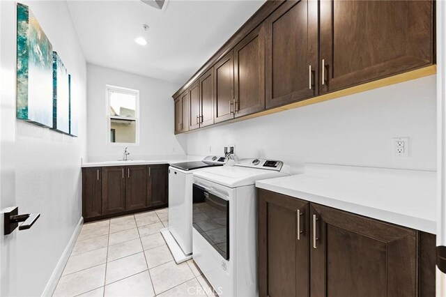 27 Alessio, Lake Forest, CA 92630 - laundry room with washer and clothes dryer, cabinet space, and light tile patterned floors