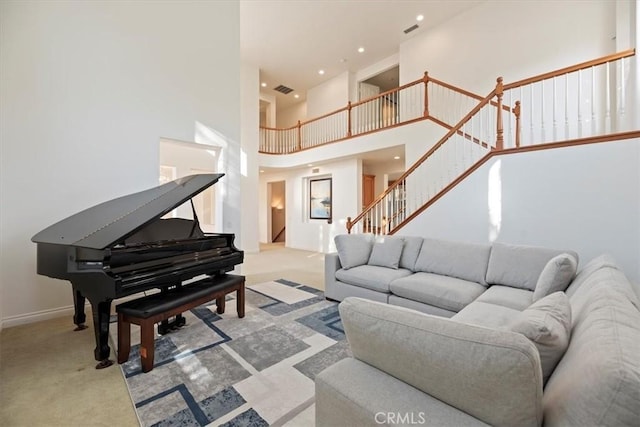 975 Manor Way, Corona, CA 92882 - living area featuring carpet floors, a high ceiling, stairway, recessed lighting, and baseboards