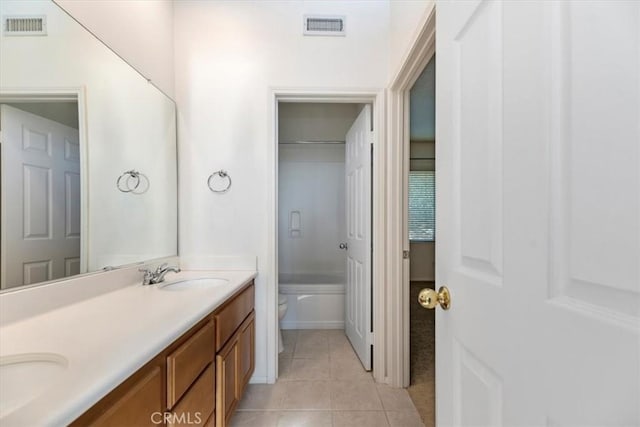 975 Manor Way, Corona, CA 92882 - bathroom with tile patterned floors, toilet, double vanity, and tub / shower combination