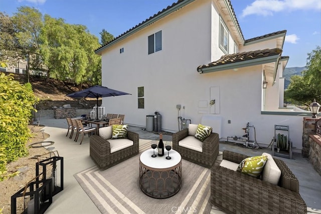 975 Manor Way, Corona, CA 92882 - rear view of property with an outdoor hangout area, stucco siding, a patio area, a tiled roof, and outdoor dining area
