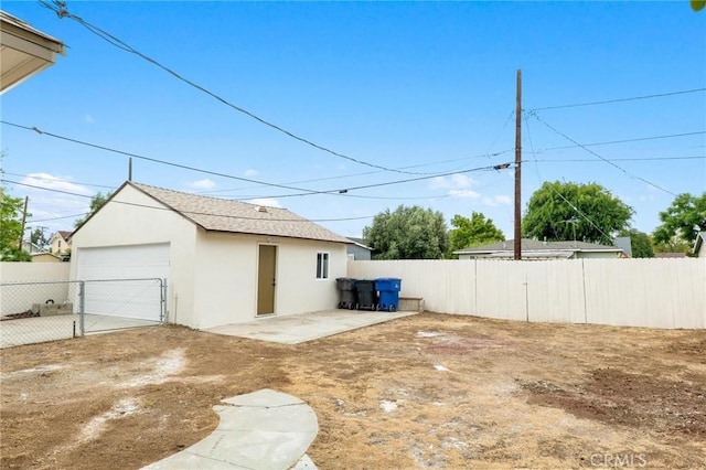 3882 Taft St, Riverside, CA 92503 - view of yard featuring fence, a garage, and an outdoor structure