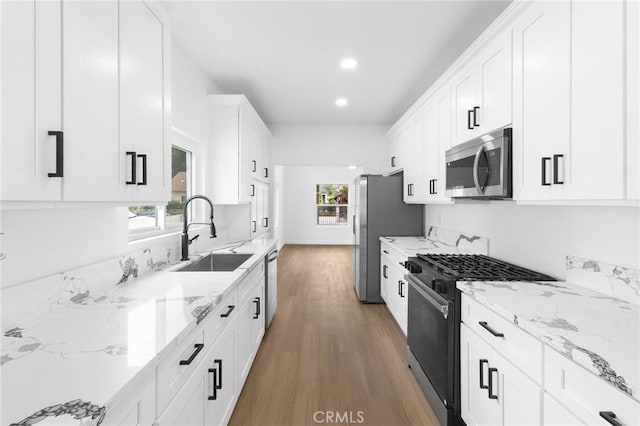 3882 Taft St, Riverside, CA 92503 - kitchen with stainless steel appliances, a sink, healthy amount of natural light, white cabinets, and recessed lighting