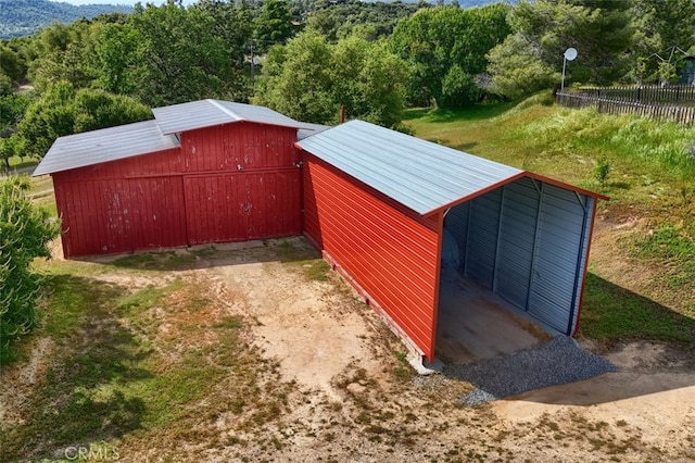 44800 Ahwahnee Acres Rd, Ahwahnee, CA 93601 - view of pole building with fence and a wooded view