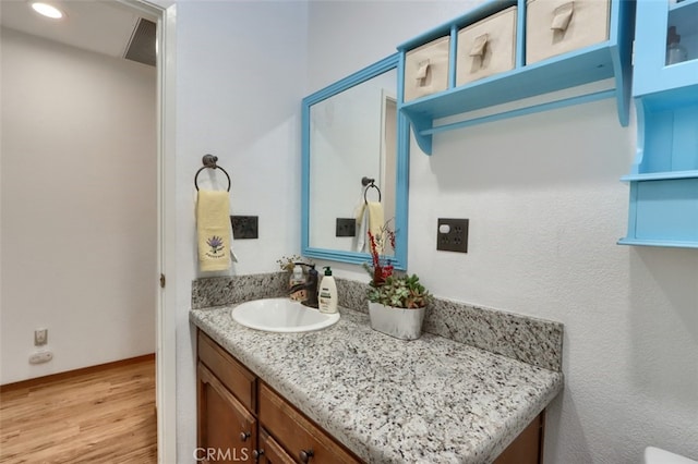 44800 Ahwahnee Acres Rd, Ahwahnee, CA 93601 - bathroom featuring wood finished floors, vanity, and recessed lighting