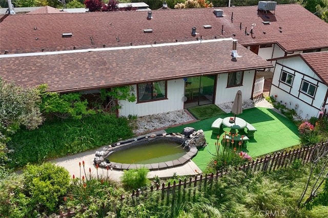 44800 Ahwahnee Acres Rd, Ahwahnee, CA 93601 - rear view of house featuring a shingled roof, a fenced backyard, and central AC unit