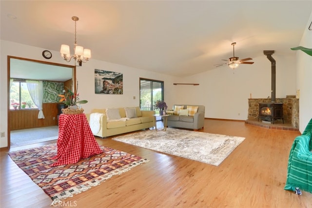 44800 Ahwahnee Acres Rd, Ahwahnee, CA 93601 - living area featuring plenty of natural light, a wood stove, wood finished floors, a chandelier, and lofted ceiling