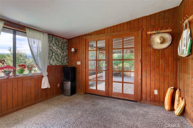 44800 Ahwahnee Acres Rd, Ahwahnee, CA 93601 - doorway to outside featuring french doors, wood walls, vaulted ceiling, carpet, and baseboards