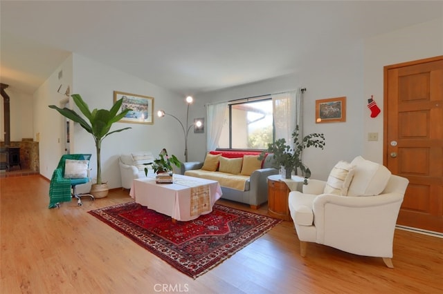 44800 Ahwahnee Acres Rd, Ahwahnee, CA 93601 - living area with wood finished floors and a wood stove