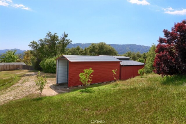 44800 Ahwahnee Acres Rd, Ahwahnee, CA 93601 - view of outdoor structure featuring a mountain view and an outbuilding
