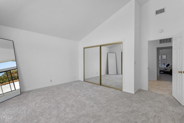 3960 W Hemlock St, Oxnard, CA 93035 - unfurnished bedroom with high vaulted ceiling, carpet, a closet, and baseboards